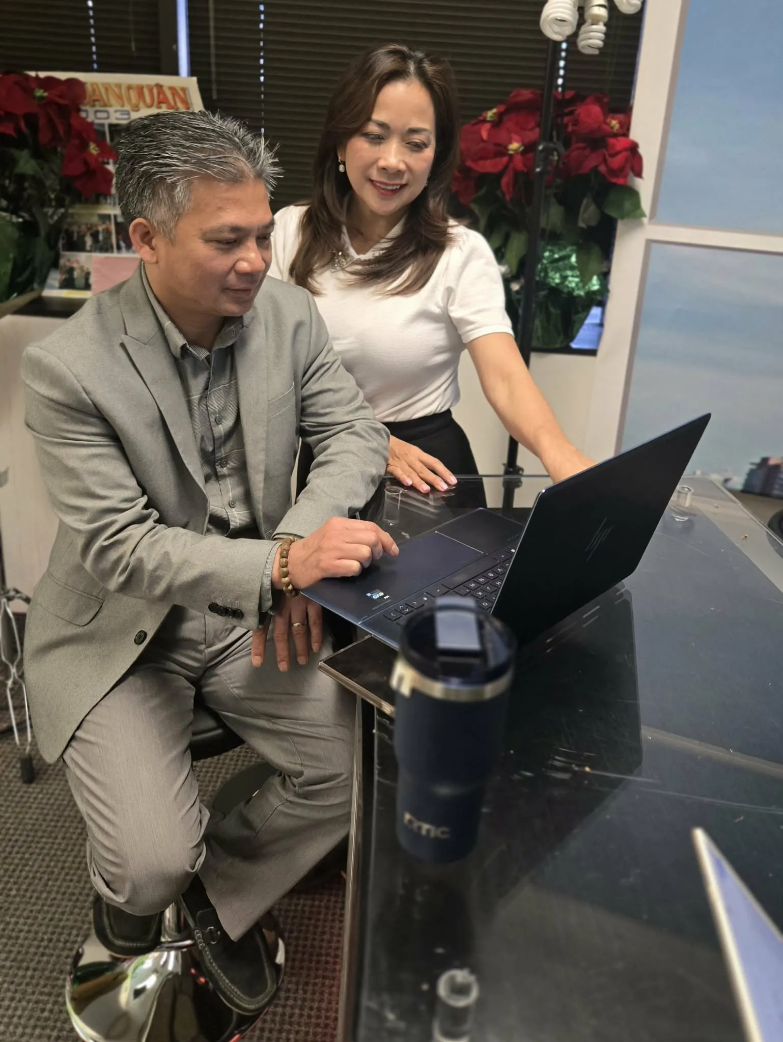 Khanh and Duyen Nguyen reviewing financial strategies