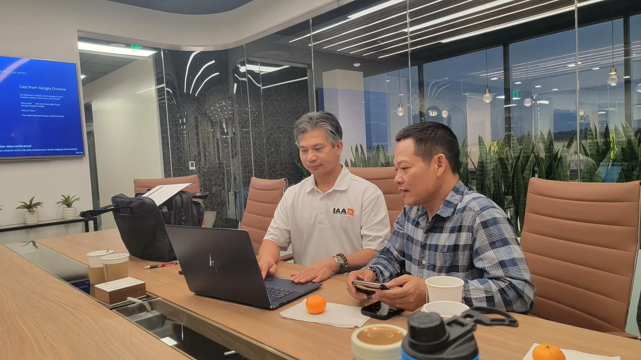 Khanh Nguyen and Steve reviewing policy options together